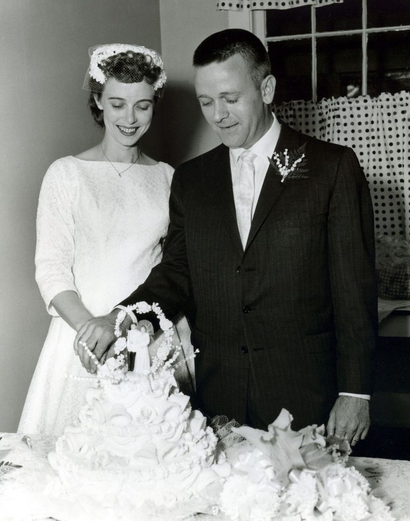 Wedding guests celebrating together at a decorated reception table